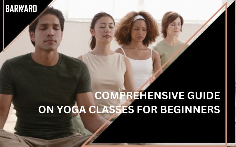 image displays a group of people participating in a yoga class, all sitting in a meditative pose with their eyes closed